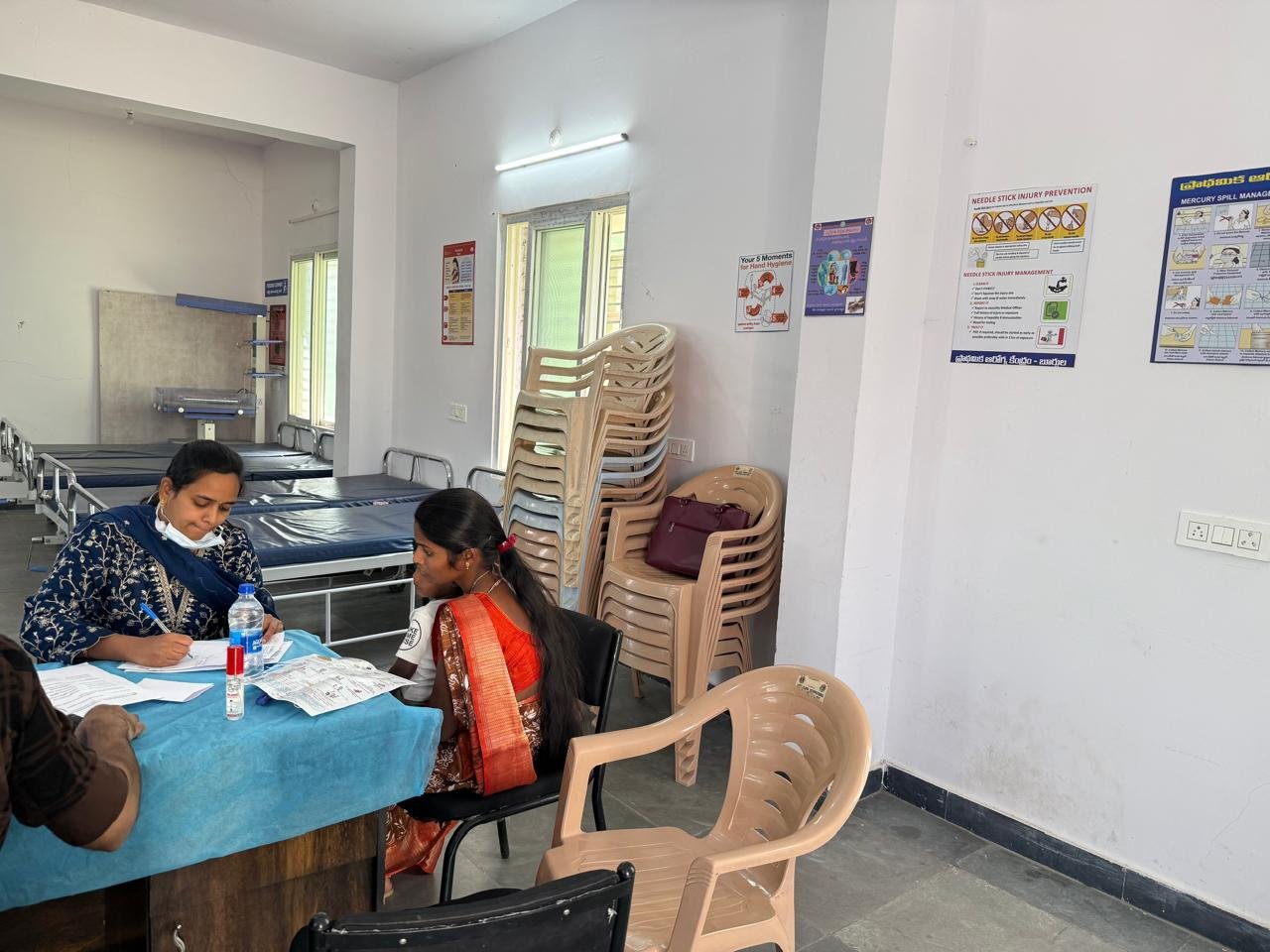 Registration volunteers verifying details at weekend health drive